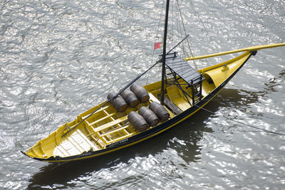 High angle view of yellow boat in sea