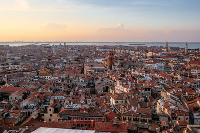 High angle shot of townscape against sky during sunset