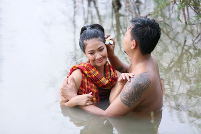 Young couple standing outdoors