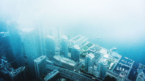 High angle view of buildings in city against sky