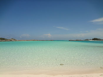 Scenic view of sea against blue sky