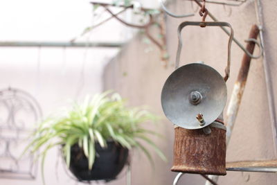 Close-up of electric lamp hanging on table