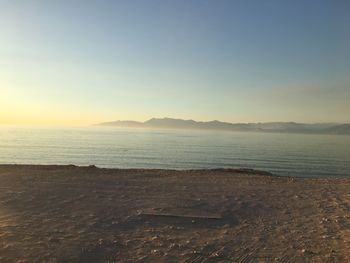 Scenic view of sea against sky during sunset