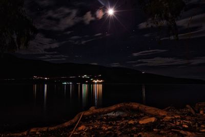 Scenic view of lake at night