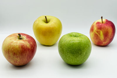 Close-up of apples on apple against white background