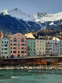 River inn and buildings, mountain and clouds, innsbruck
