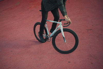 Low section of man riding bicycle