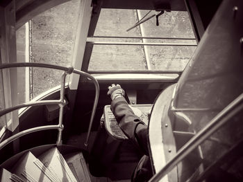 High angle view of man sitting in land vehicle