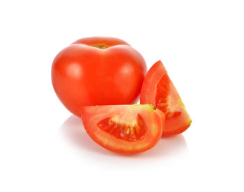 Close-up of tomatoes against white background