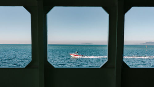 Sailboat on sea against clear sky