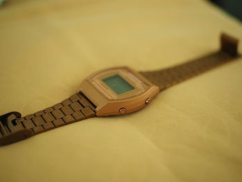 Close-up of clock on table