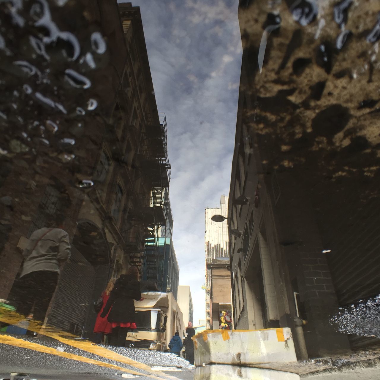 architecture, building exterior, built structure, sky, street, city, low angle view, building, history, residential building, outdoors, incidental people, day, residential structure, car, old town, travel destinations, road, old, no people