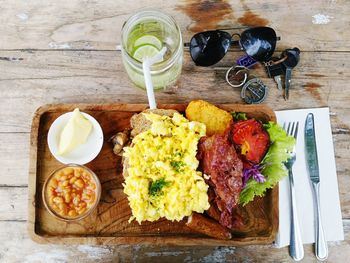 High angle view of meal with sunglasses and keys on table in restaurant