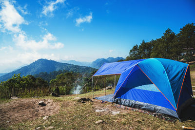 Scenic view of mountains against blue sky