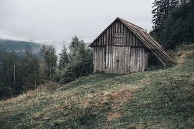 House on field against sky