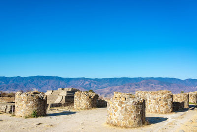View of ruins against clear blue sky