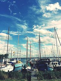 Boats moored at harbor