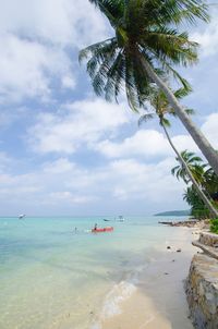 View of beach against cloudy sky