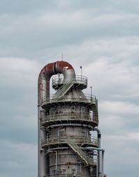 Low angle view of factory against sky