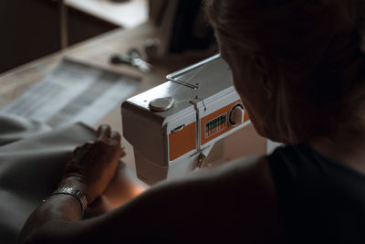 Close-up of man working at home