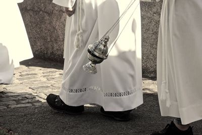 Low section of  catolic priest in a procession 