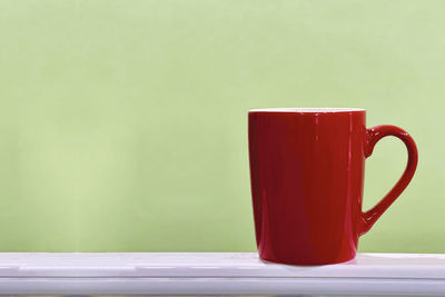 Close-up of coffee cup on table