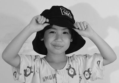 Portrait of smiling girl wearing hat