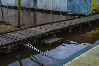 Reflection of building on pier in lake