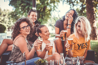 Group of people drinking glasses outdoors