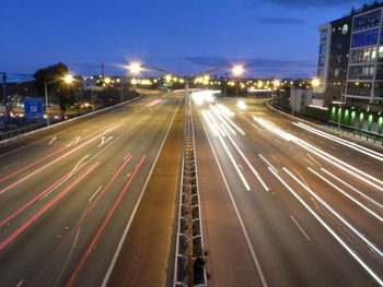 Light trails on road in city at night