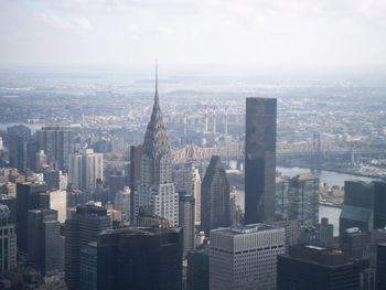 High angle view of modern buildings in city against sky