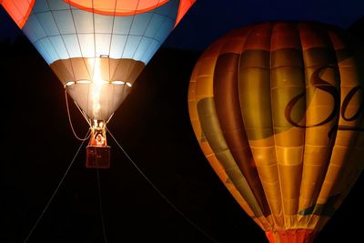 Low angle view of illuminated hot air balloons