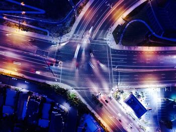 High angle view of cars on road in city at night