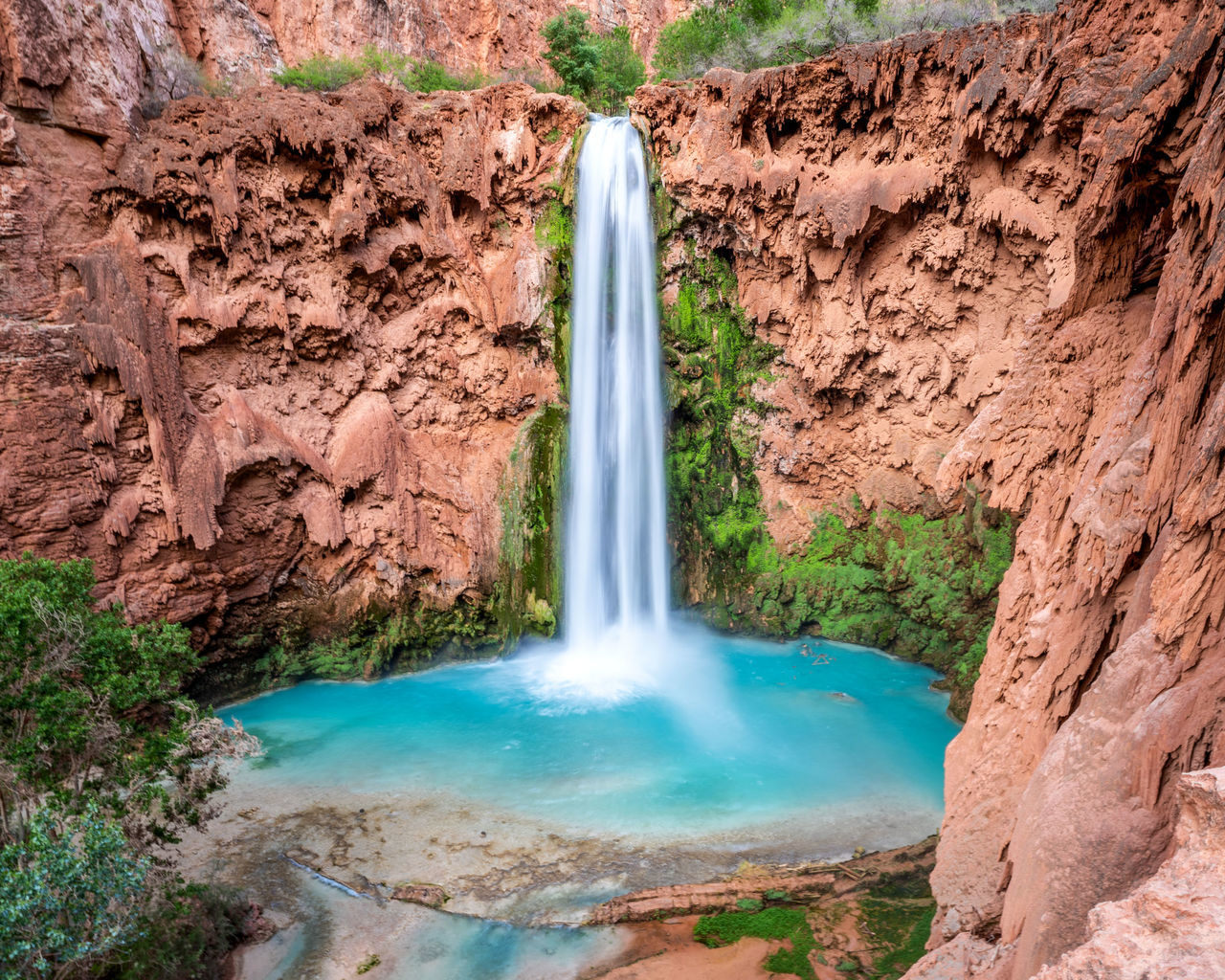 water, scenics - nature, waterfall, rock, beauty in nature, rock - object, nature, solid, rock formation, motion, non-urban scene, travel destinations, no people, long exposure, land, environment, tranquil scene, flowing water, day, falling water, flowing, outdoors, power in nature, formation