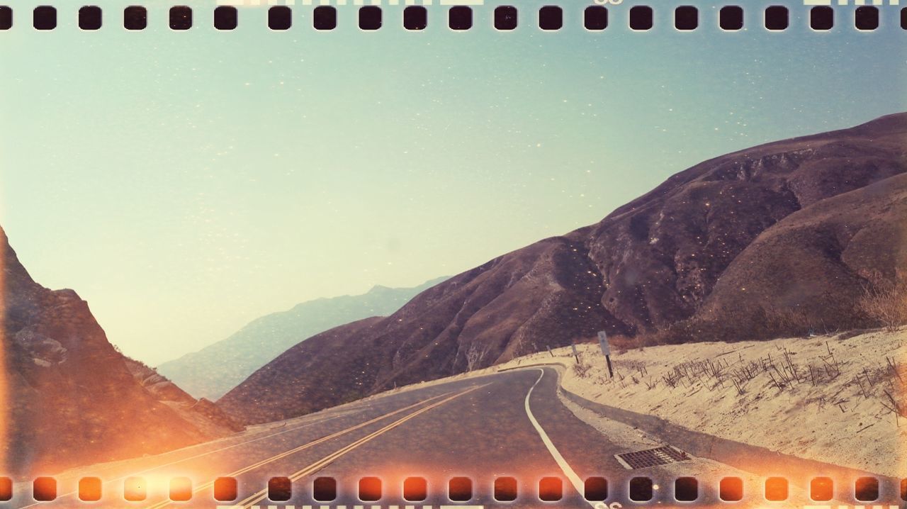 mountain, nature, sky, no people, mountain range, beauty in nature, scenics - nature, outdoors, transportation, day, environment, road, high angle view, landscape, land, the way forward, tranquil scene, tranquility