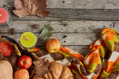 High angle view of fruits and leaves on table