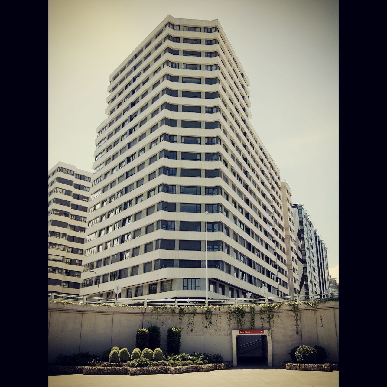 building exterior, architecture, built structure, city, building, window, office building, clear sky, modern, skyscraper, sky, residential building, city life, low angle view, car, residential structure, auto post production filter, transfer print, day, apartment