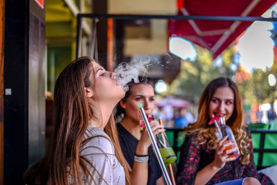 Young woman enjoying music concert