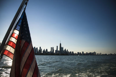 Chicago city from lake michigan with us flag