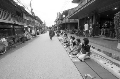 Footpath amidst street in city