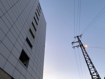 Low angle view of cables against sky