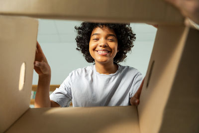 Portrait of young woman using mobile phone