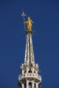 Low angle view of traditional building against blue sky