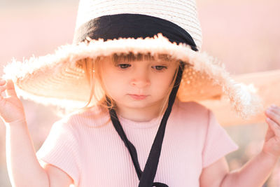 Close-up of cute girl wearing hat