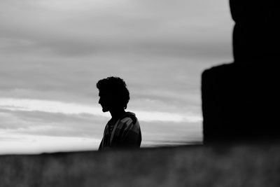Portrait of silhouette man standing against sky during sunset