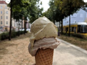 Close-up of ice cream cone against brick wall