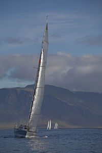 Sailboat tipping in wind close to reykjavik