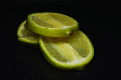 Close-up of lemon slice over black background