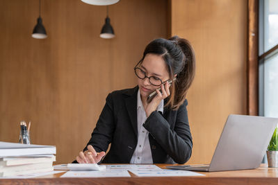 Businesswoman working at desk in office