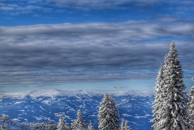 Scenic view of snow covered landscape against sky